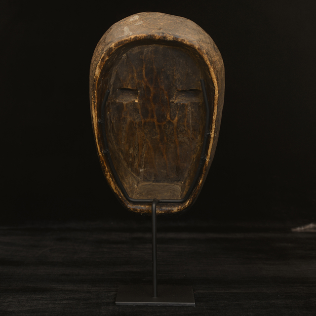 African Bete mask on display stand back