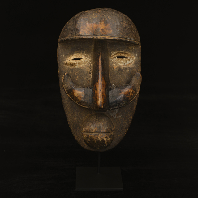 African Bete Mask on display stand