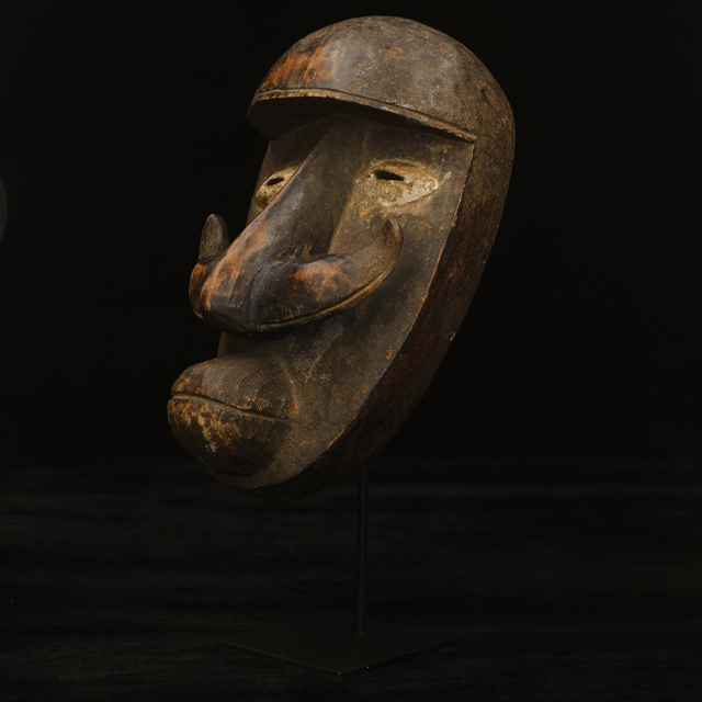African Bete mask on display stand Left Angle