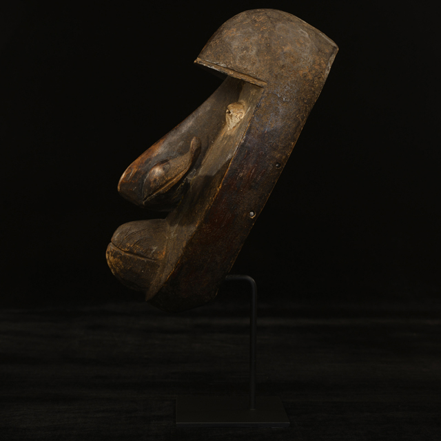 African Bete mask on display stand Left Side