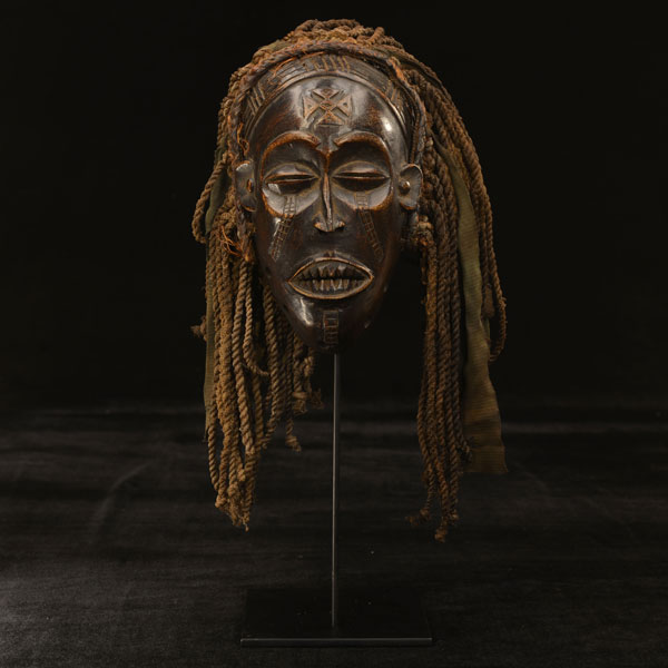 African Chokwe mask on display stand