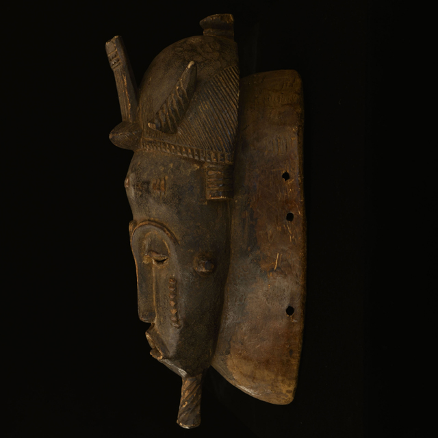 African mask from the yaure tribe of Ivory Coast left side